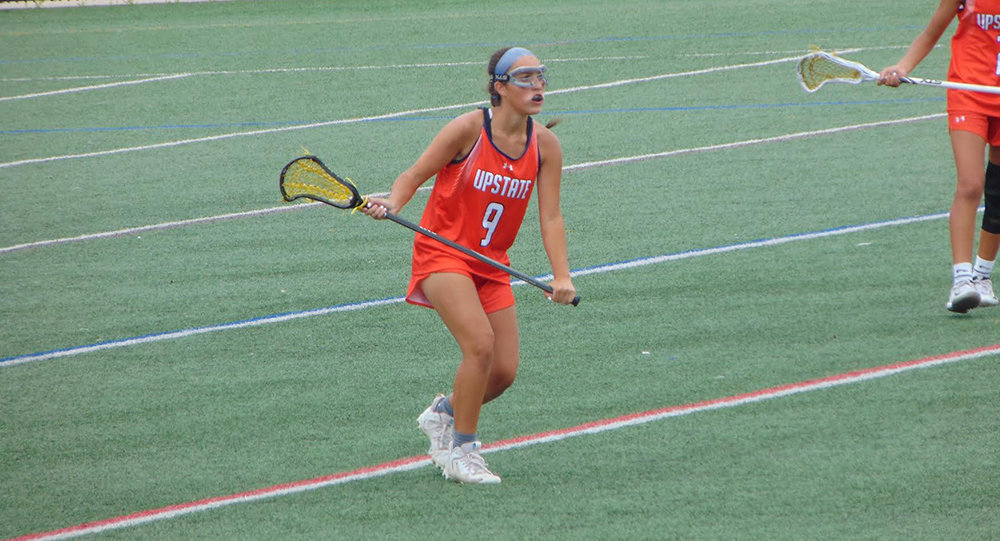 Lorena Rivera playing in the Under Armour All-America Lacrosse Tournament.